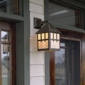 Bungalow 10 inch wall lantern with Craftsman overlay mounted beside a wood front door on a covered porch