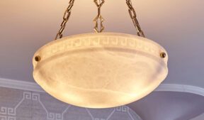 Illuminated alabaster bowl pendant showing natural stone variations